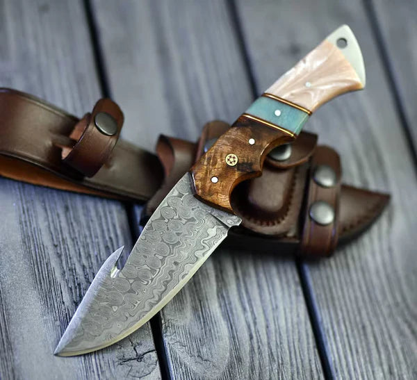 The Hunter's Edge: 8.25-Inch Gut Hook Skinning Hunting Knife with Raindrops Damascus Steel Blade, Rosewood and Epoxy Resin Handle