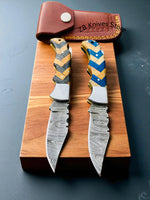 Strong steel bolster on a premium EDC pocket knife with custom leather case.