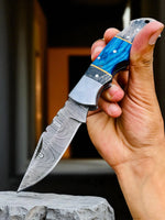 Blue Ridge Damascus Pocket Knife with exotic wood handle, folded for easy storage and carrying