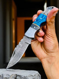 Blue Ridge Damascus Pocket Knife with exotic wood handle, folded for easy storage and carrying