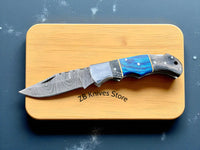 Steel bolster and back lock mechanism of the Blue Ridge Damascus Pocket Knife, designed for durability and enhanced safety.